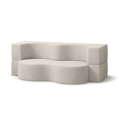 Kamelia Outdoor Foam Sofa Bed in Modern Style with Organic Form in Harris Outdoor Fabric – angled view