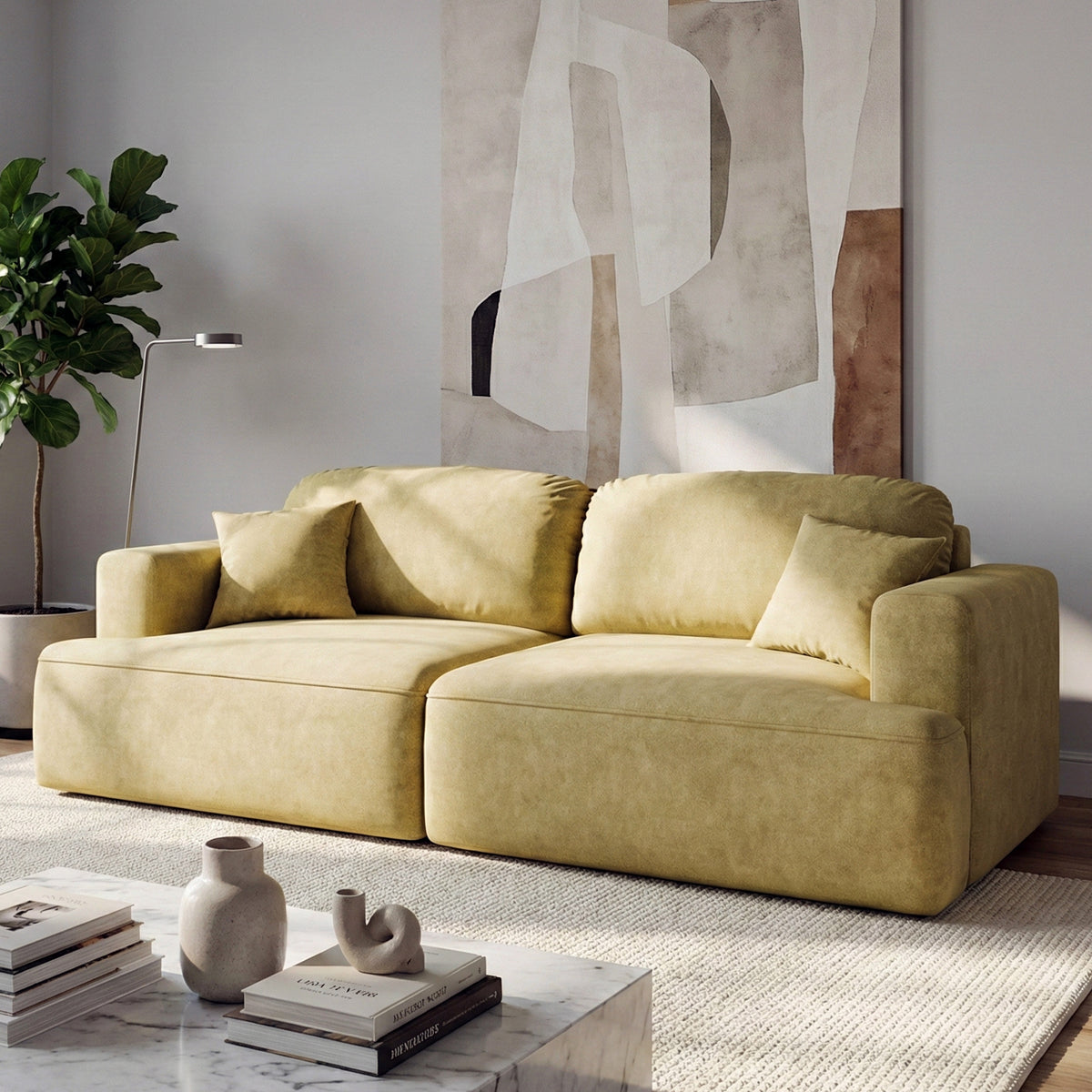 Canapé Senvali 241 cm Sépia Dorée (CLOUD 32) dans un salon lumineux avec une plante, un tableau et une table basse en marbre
